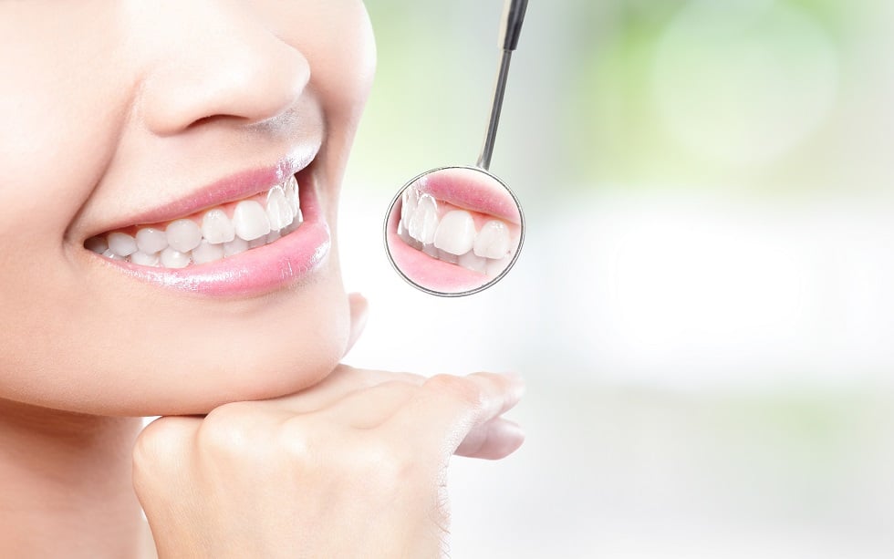 Healthy woman teeth and cosmetic dentist